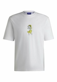 Hvid bomulds T-shirt med et grafisk tryk af en tegneserie-dinosaur i gul med sorte detaljer, placeret på venstre brystområde. Enkel rund halsudskæring.