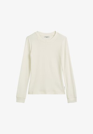 Kremowa koszula z długim rękawem wykonana z prążkowanej tkaniny, z okrągłym dekoltem i dopasowanymi mankietami. Prosty wzór bez dodatkowych zdobień.