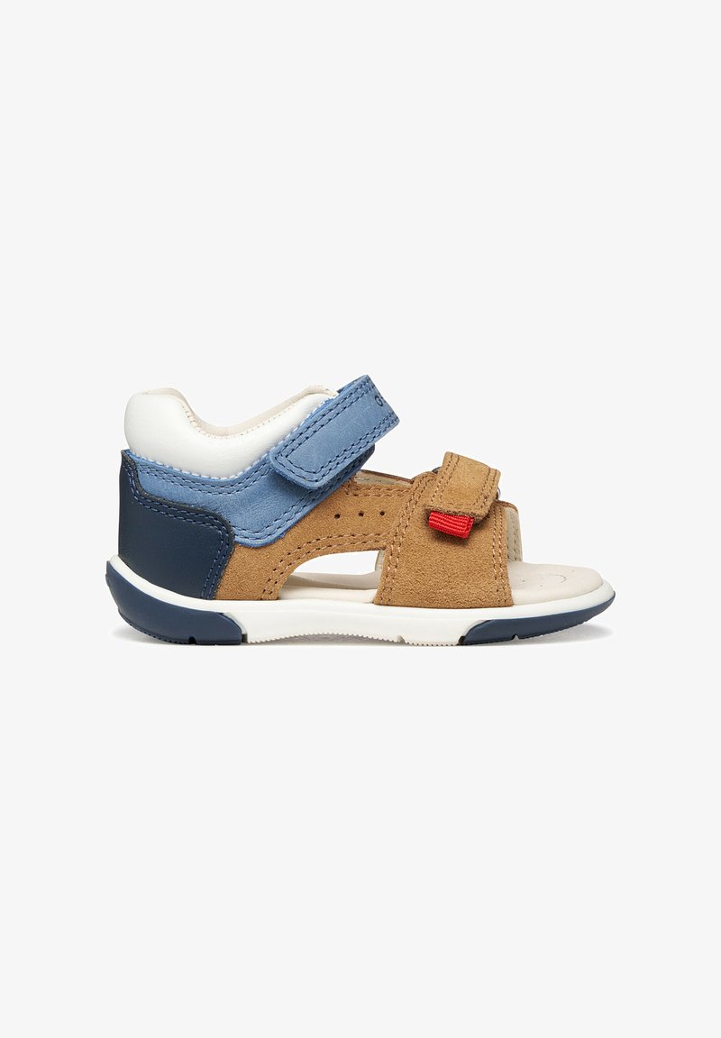 Sandale à bout ouvert pour enfant en daim beige, cuir bleu et marine avec brides réglables à scratch et semelle blanche rembourrée.