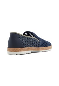 Navy blue woven slip-on shoes with a textured upper, leather accents, and a light-colored rubber sole featuring a jute-like wrapping.