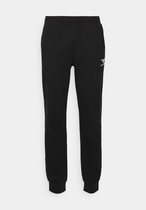 Pantaloni sportivi neri con vita e polsini elasticizzati. Presentano un piccolo logo bianco sul lato. Realizzati in un morbido tessuto misto cotone.