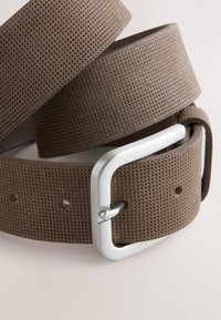 Brown perforated leather belt with a silver metal buckle and smooth edges, featuring multiple holes for adjustable fit.