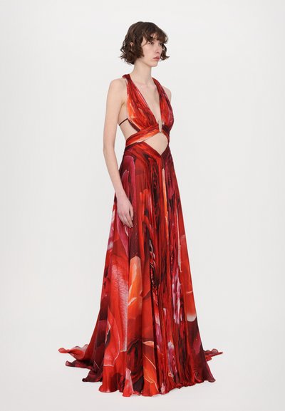Red floral dress with a deep V neckline, cut-out waist, and flowing fabric. Features bold color and a cinched waist design for shape.