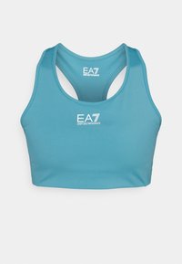 Τιρκουάζ αθλητικό σουτιέν με κομψό σχέδιο, στυλ racerback και λευκό λογότυπο "EA7 Emporio Armani" μπροστά. Κατασκευασμένο από απαλό, ελαστικό υλικό.