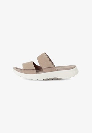 Beige suede slide sandals featuring two wide straps, cushioned footbed, and a white rubber outsole with textured grip.