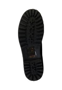 Zwarte rubberen zool met diepe loopprofielen, met zigzag- en kruispatronen. Inclusief ingebedde label met veiligheidsymbolen.