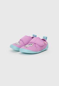 Pink fabric shoes with a velcro strap, featuring a unicorn design and light blue rubber soles. Lightweight and flexible construction.