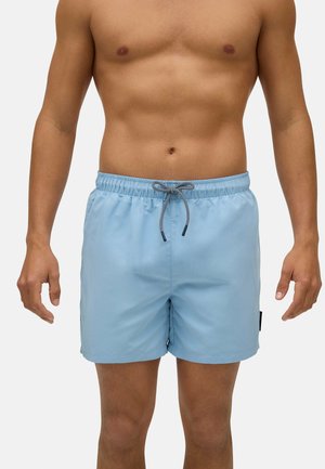 Bañador azul claro hecho de tela suave, con una cinturilla elástica con cordón y bolsillos en las costuras laterales.