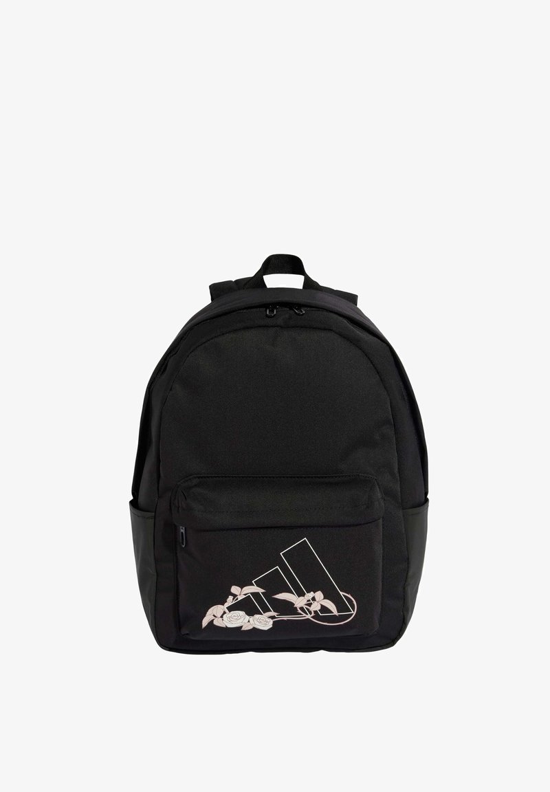 Black fabric backpack with a rounded shape, featuring a front pocket adorned with a white floral and logo design. Zippered main compartment.