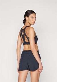 Salomon CROSS RUN BRA  - Športni modrček z močno podporo - deep black