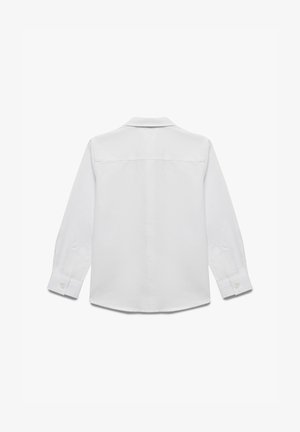 Valkoinen pitkähihaisten paita, joka on valmistettu puuvillasta. Siinä on klassinen kaulus, napilliset hihansuut ja kaareva helma. Sileä pinta ilman kuvioita.