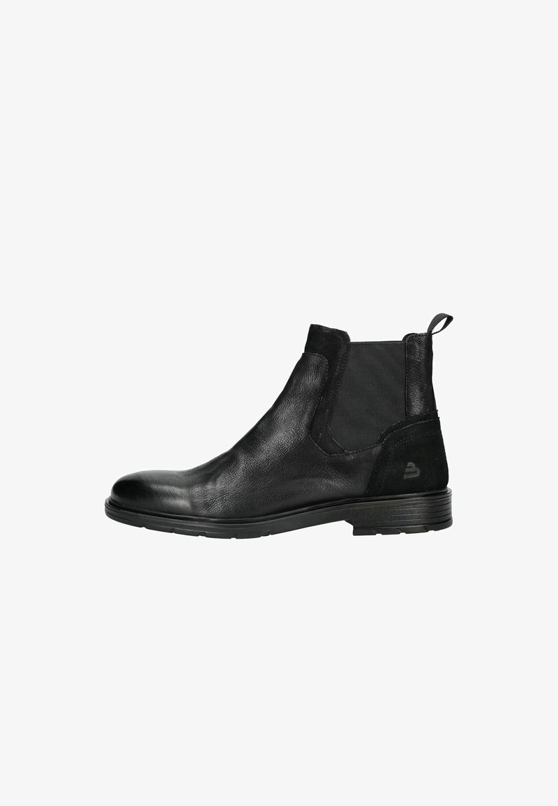 Des bottes Chelsea en cuir noir présentent une finition lisse, des panneaux latéraux élastiques, un bout rond et un talon bas empilé. Une languette à l'arrière.