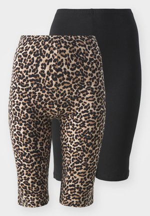 Kaks paari legginsid: ühed mustad ja ühed leopardimustriga. Mõlemad on keskmise kõrgusega, elastse vöökoha ja siledaga.