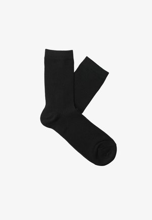 Svarte bomullssokker med ribbet tekstur, mellomlang lengde og en sømløs tådesign, med et enkelt og klassisk utseende.