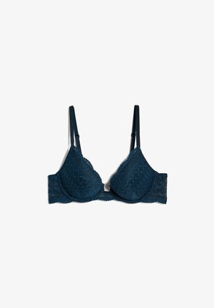 Donker teal kanten bh met een geometrisch patroon, driehoekige cups, verstelbare bandjes en een golvende rand langs de halslijn en band.