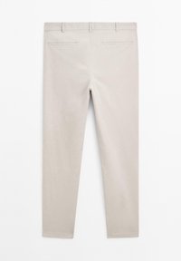 Light beige trousers with a slim fit, featuring a smooth texture, belt loops, and two back pockets. No visible patterns or hardware.