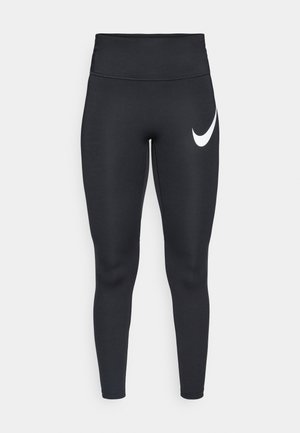Black high-waisted athletic leggings with a white Nike swoosh logo on the upper left thigh against a white background.