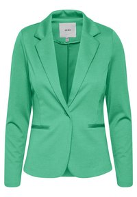 Zelený blazer vyrobený z elastické tkaniny, má klopový límec, zapínání na jeden knoflík a dvě přední kapsy. Hladká, lehká textura.