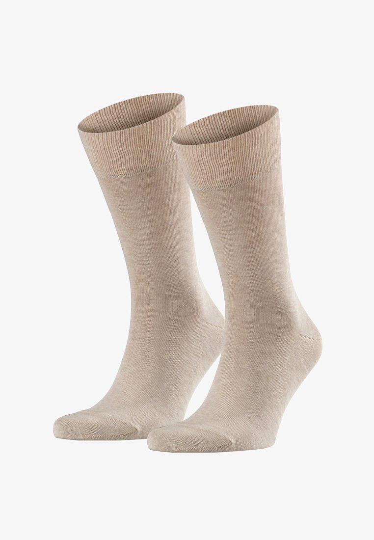 Chaussettes en coton beige avec des bords côtelés, de épaisseur moyenne, texture douce et orteils renforcés. Convient pour un usage quotidien ou décontracté.