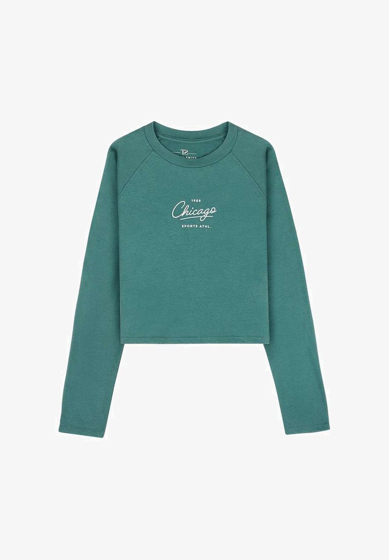 Sweat-shirt court à manches longues couleur sarcelle avec le texte "1989 Chicago Sports Athl." imprimé en blanc au centre devant.