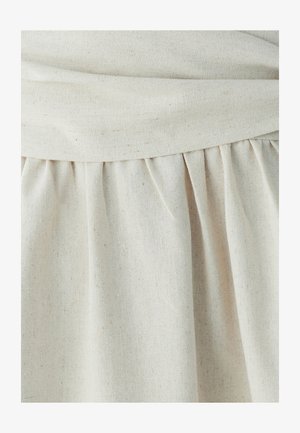 Lichtbeige stoffen rok met een gestructureerde afwerking, voorzien van een geraffineerd ontwerp langs de zoom en een soepele tailleband.