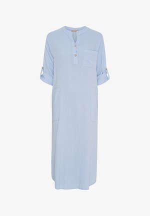 Lyseblå, linnedragt med rund halsudskæring, tre knapper, korte ærmer oprullet og sidelommer. Har en afslappet pasform.