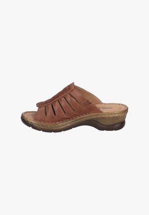 Brown leather slide sandal with cut-out design, textured sole, and curved heel. Features stitching accents and a cushioned insole.