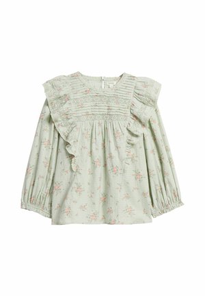 Light green long-sleeve blouse with pink floral print, lace details, and ruffled trim along the chest and shoulders.