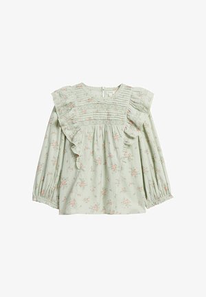 Hellgrüne Bluse mit langen Ärmeln, rosafarbenem Blumenmuster, Spitzendetails und Rüschensaum entlang der Brust und Schultern.