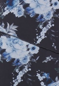 Floral fabric featuring large blue and white flowers on a dark background, with a soft texture and delicate leaf accents.