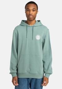 Hooded sweatshirt in soft green fabric. Features a front pocket, drawstring hood, and a white circular logo on the left chest.