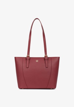Sac cabas en cuir bordeaux avec doubles bretelles, boucles dorées et petit logo circulaire doré centré à l'avant.