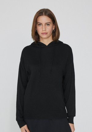 Schwarzer Kapuzenpullover mit weicher Textur, langen Ärmeln und geripptem Saum. Mit Kordeln am Kragen und lässiger Passform.