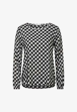 T-shirt à manches longues en motif pied-de-poule noir et blanc, avec un col rond et une coupe décontractée avec des poignets élastiques. Texture de tissu douce.