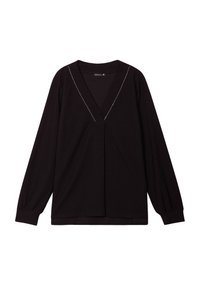 Haut noir à manches longues avec un décolleté en V, en tissu texturé, à manches bouffantes et avec des coutures blanches contrastantes le long du décolleté.