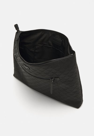 Textured black leather clutch bag with a zip closure. Interior features fabric lining and additional pockets for organization.
