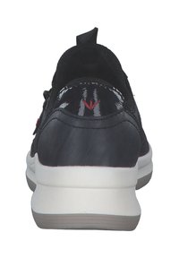 Black leather sneaker with red accent logo, rounded shape, textured surface, white midsole, and pull tab at heel for easy wear.