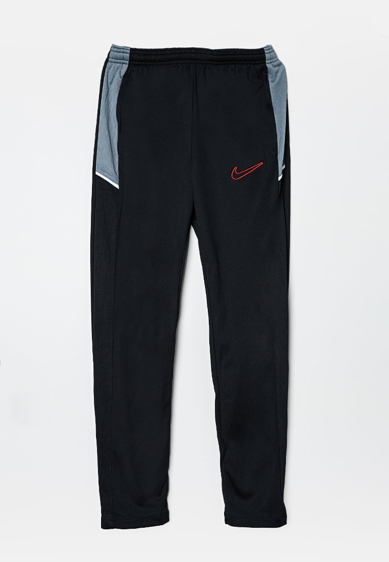 Pantalons de sport noirs avec des panneaux latéraux gris, taille élastique et logo Nike rouge sur la cuisse gauche. Fabriqués en matériau léger et respirant.