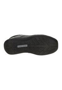Suela de zapato de goma negra con patrón de relieve texturizado. Presenta una superficie lisa y el nombre de la marca "JOSEF SEBEL" en relieve.