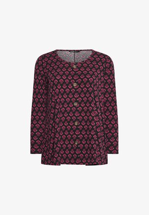 Zwarte blouse met lange mouwen, voorzien van een bloemenpatroon in roze, bruine knopen en een gestructureerde stof.