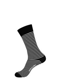Chaussettes à rayures noires et blanches avec un bord noir uni. Fabriquées en tissu au texture lisse. Présentent un motif rayé contrastant et un logo.