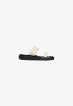 Flip-flop sandal featuring a light beige upper made of synthetic material and a textured black rubber sole with a simple design.