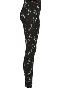 Leggings noirs avec un motif floral comportant des fleurs blanches et colorées. Fabriqués en matière extensible avec une coupe ajustée et un design longueur cheville.