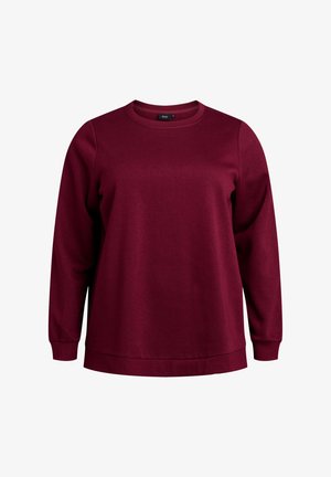 Bordowy sweatshirt z okrągłym dekoltem, długimi rękawami i luźnym krojem. Wykonany z miękkiej tkaniny, z ribbowanymi mankietami i dołem.