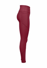 Röda leggings tillverkade av ett stretchigt material, med hög midja och vinklade sömdetaljer för en åtsittande silhuett.