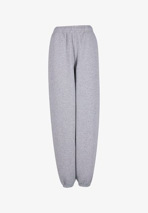 Grå sweatpants lavet af blød stof, med en elastisk talje og manchetter, i en løs pasform og uden synlige mønstre eller hardware.