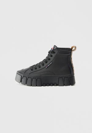 Black high-top sneakers with a textured rubber sole, featuring a lace-up design, logo detail, and a patterned accent on the heel.