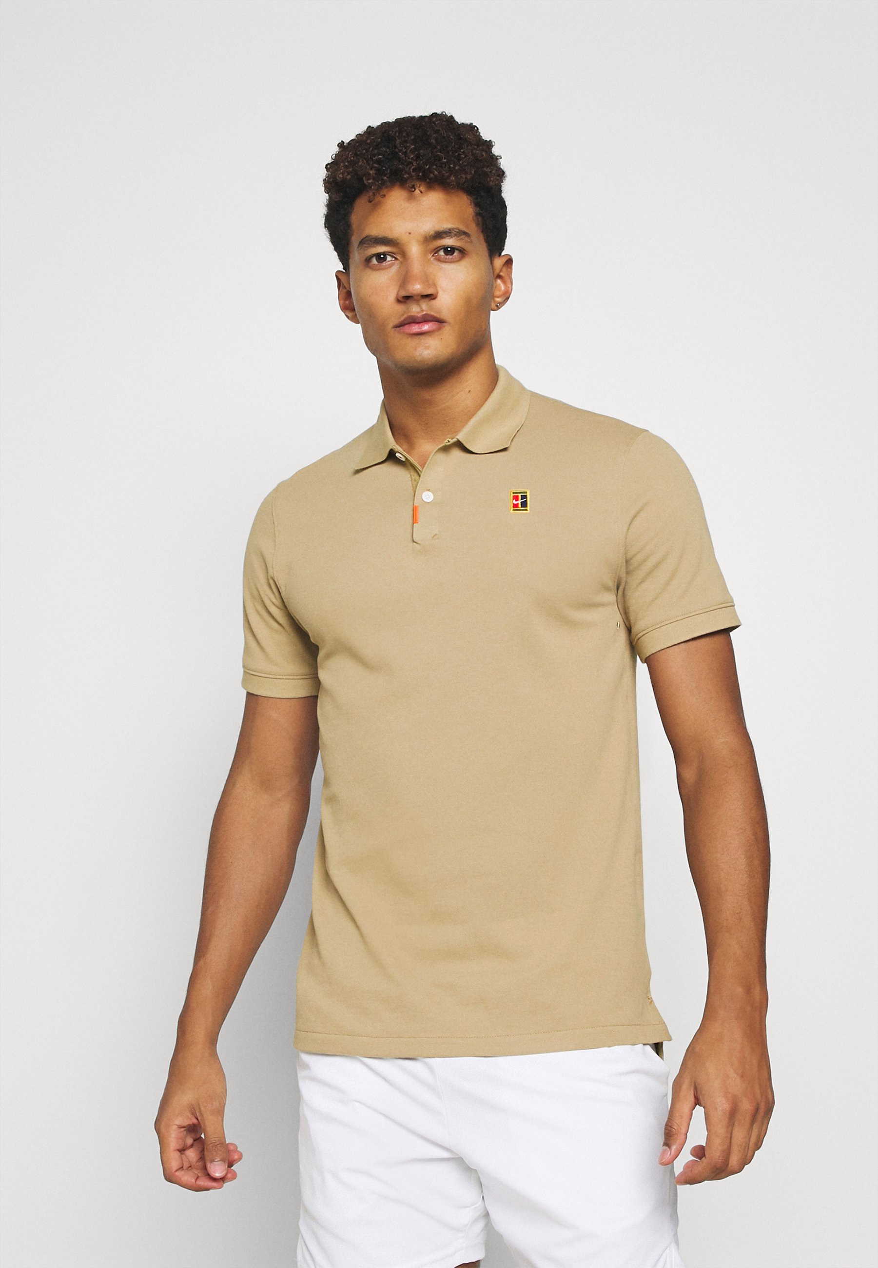 Nike Performance HERITAGE - Sports shirt - parachute beige/tan - Zalando.de