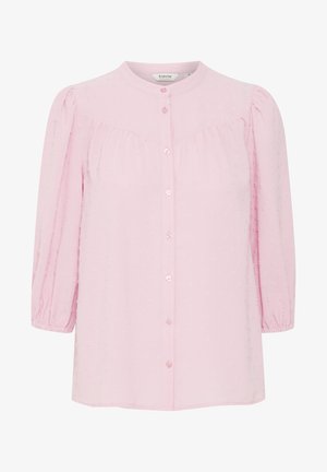 Light pink blouse with a round collar, button front, and three-quarter puff sleeves. Features a textured pattern throughout the fabric.