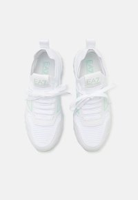 Pair of white EA7 Emporio Armani sneakers with laces tied, featuring mint green accents and pull tabs on a white background.